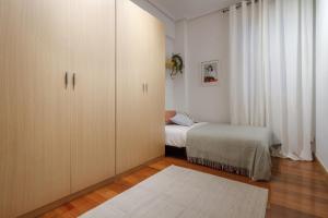 En eller flere senge i et værelse på Fernandez Campo, Vivienda Turística Céntrica Reformada con Wifi