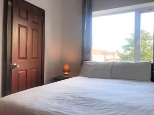 Postel nebo postele na pokoji v ubytování Lyttleton Guest House Limited