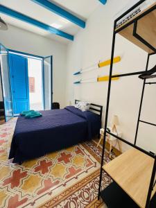 a bedroom with a bed in a room at Oltremare Apartments in Santa Flavia