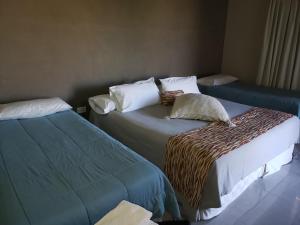 Una cama o camas en una habitación de Marvic Hotel