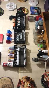 a group of wine bottles sitting on top of a table at Pousada Family Consulado Americano in São Paulo