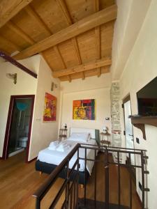a bedroom with a bed in a room with wooden ceilings at LOCAZIONE TURISTICA IL BRICCHETTO in Parodi Ligure