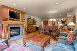 a living room with a couch and a fireplace at Lodges at Deer Valley - #2218 in Park City