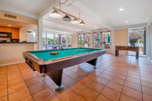 a living room with a pool table in it at Sweet Escape in San Diego