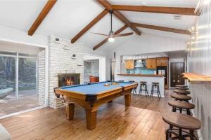 a living room with a pool table in it at Salt Water Pool & Backyard Oasis @ Wild Eagle in San Antonio