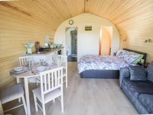 a room with a bed and a table and a couch at Ailsa Craig in Worcester