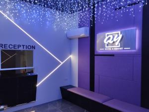a room with a purple wall with a sign at Qing Yun Rest House Koprijaya, Brunei Darussalam in Bandar Seri Begawan +23 photos