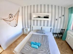a bedroom with a bed and a hammock in it at Best view Apartment in Novi Sad