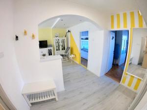 a living room with an archway leading into a room at Best view Apartment in Novi Sad