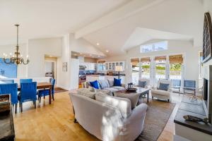 a living room with a couch and a table at Golden Getaway in Summerland