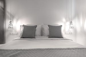 A bed or beds in a room at Manesis Suites