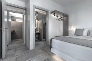 A bed or beds in a room at Manesis Suites