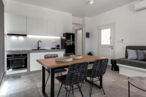 A kitchen or kitchenette at Manesis Suites