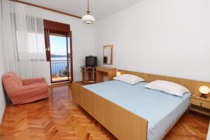 Postel nebo postele na pokoji v ubytování Apartment Trogir 6023c
