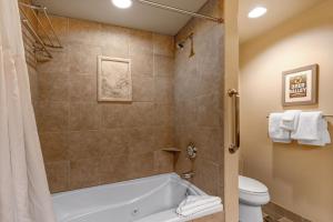 a bathroom with a tub and a toilet at The Lodges at Deer Valley-B - #5325 in Park City