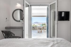 A bed or beds in a room at Manesis Suites