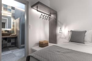 A bed or beds in a room at Manesis Suites