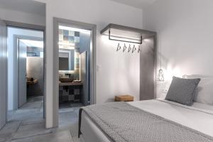 A bed or beds in a room at Manesis Suites