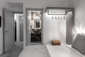 A bed or beds in a room at Manesis Suites
