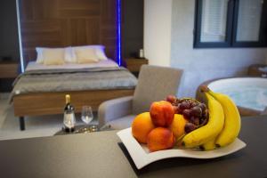 a plate of fruit on a table in a room at Jacuzzi Sauna SelfCheckIn Mystic in Mostar