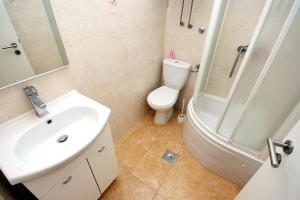 a bathroom with a toilet and a sink and a shower at Apartment Drasnice 6051b in Drasnice