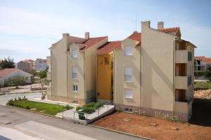 an overhead view of a row of houses at Apartments with a parking space Vodice - 6183 in Vodice