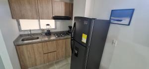 Kuchyň nebo kuchyňský kout v ubytování Apartamento Completo Ibague - Parqueadero - Ocobo