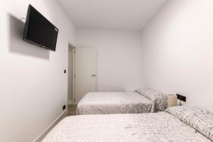 Ένα ή περισσότερα κρεβάτια σε δωμάτιο στο Eguia Home Bilbao +18 φωτογραφίες