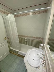 a bathroom with a sink and a shower at OLO Hostel in Santa Fe