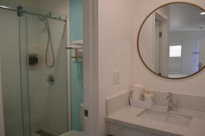 a bathroom with a shower and a sink and a mirror at Calafia Inn San Clemente Newly renovated in San Clemente