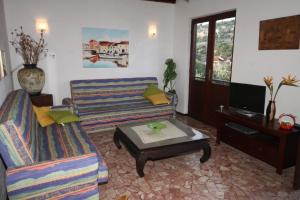 a living room with a couch and a coffee table at Seaside holiday house Razanj, Rogoznica - 7514 in Rogoznica