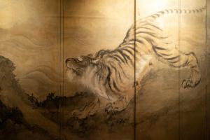 a painting of a tiger on a wall at Hotel Hagoromo in Shizuoka