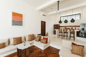 a living room with a couch and a table at Villa Lamer Canggu in Canggu