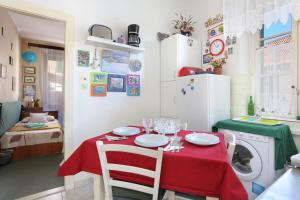 a kitchen and dining room with a table and a washing machine at Apartments with WiFi Split - 7588 in Split