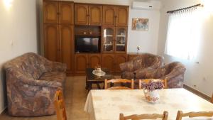 a living room with two couches and a table at Apartments with a parking space Pula - 7420 in Pula