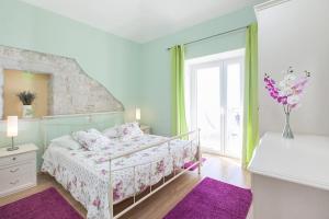 a bedroom with a bed and a large window at Holiday house with a swimming pool Gornja Podgora, Makarska - 5985 in Podgora