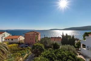 a view of the sea from the apartment at Apartments by the sea Seget Vranjica, Trogir - 5964 in Seget Vranjica