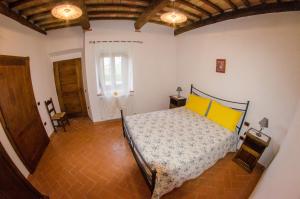 Postel nebo postele na pokoji v ubytování Agriturismo podere Casano