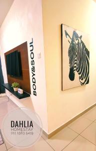 a painting of a zebra hanging on a wall at Dahlia Homestay Putrajaya in Putrajaya