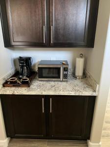 a microwave sitting on a counter in a kitchen at Queen creek az casita in Queen Creek
