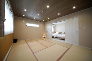 Una cama o camas en una habitación de 白浜貸別荘2−43