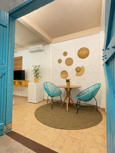 a dining room with a table and two chairs at Villa Tiê Paraty in Paraty