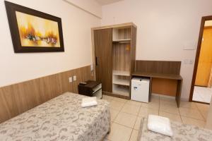Postel nebo postele na pokoji v ubytování HOTEL EXECUTIVO