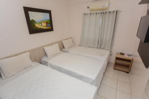 Postel nebo postele na pokoji v ubytování HOTEL EXECUTIVO
