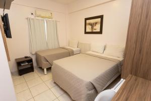 Postel nebo postele na pokoji v ubytování HOTEL EXECUTIVO