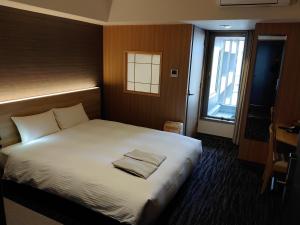 Postel nebo postele na pokoji v ubytování ALA HOTEL KYOTO + 31 fotografií