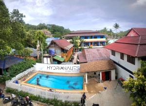 an overhead view of a swimming pool next to a building at Hydronauts Diving Resort - Koh Tao in Koh Tao