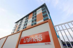 a sign in front of a building at Matasiri Residence in Ban Bang Phang