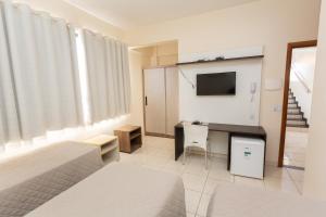 Postel nebo postele na pokoji v ubytování HOTEL EXECUTIVO