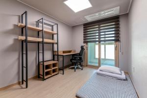Postel nebo postele na pokoji v ubytování EdenStay
